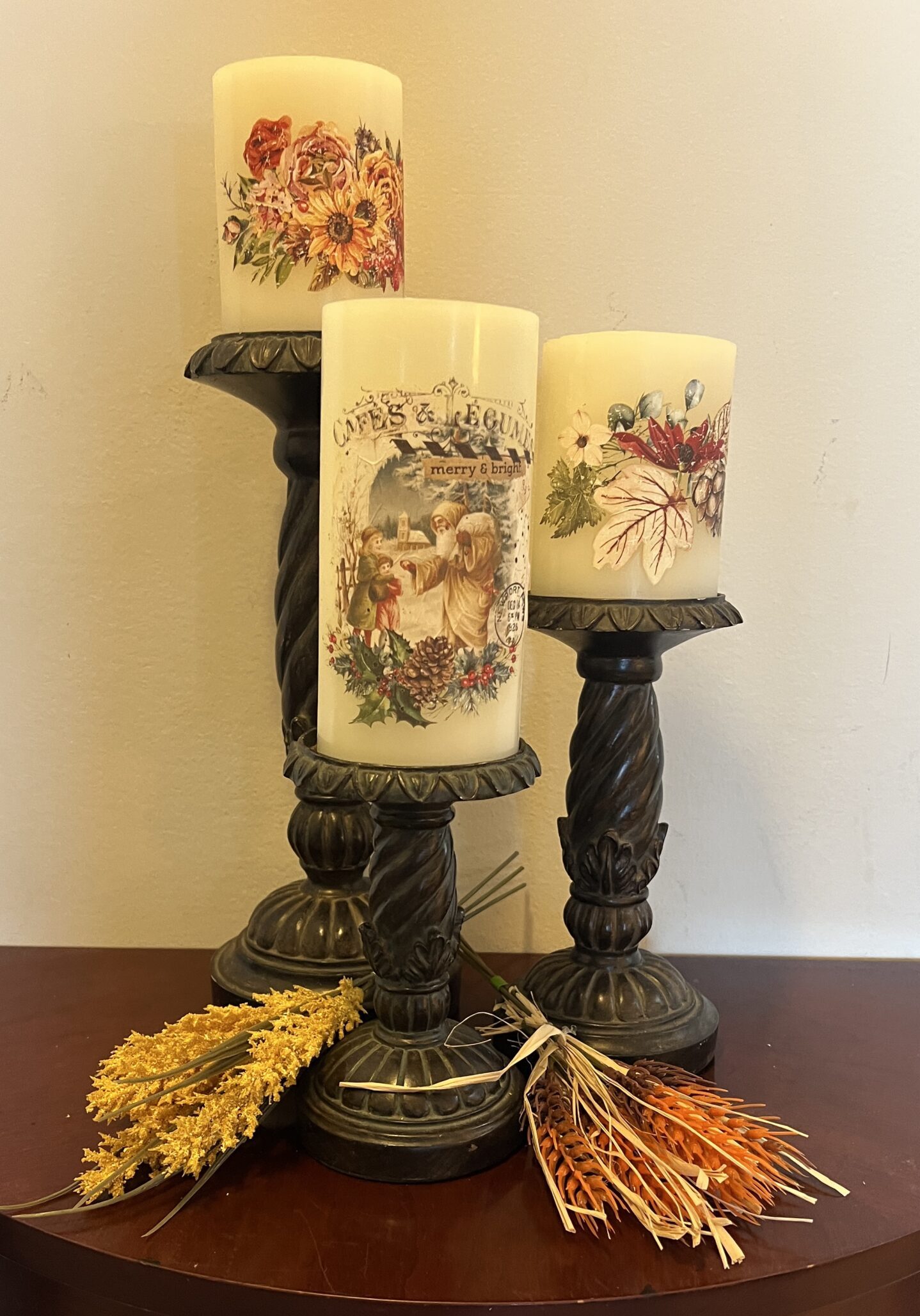 3 candlesticks with candles